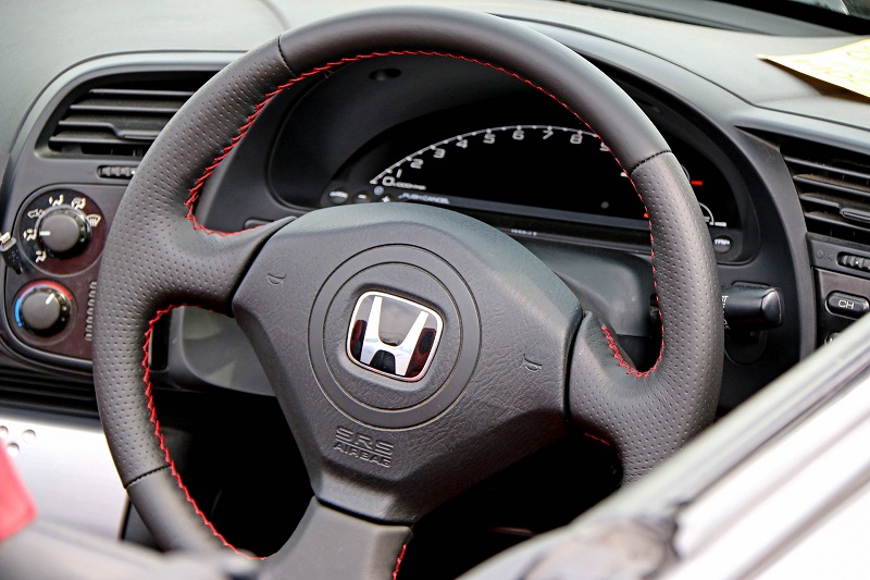 Gas Saving Tips Close Up of a Honda Steering Wheel