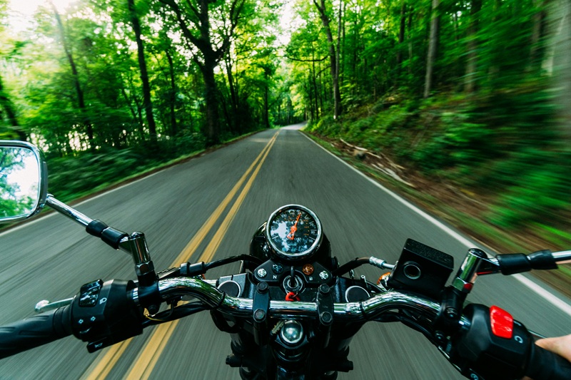 Sharing the Road with Bikers View of a Road From the Handle Bars of a Motorcycle