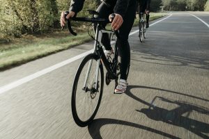 Sharing the Road with Bikers View of a Bicyclist Riding in a Road