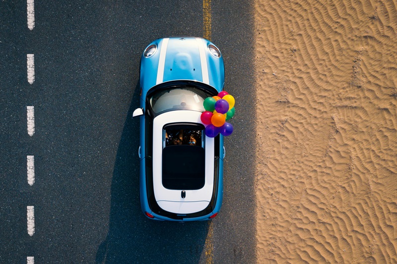 How to Get a Driving License in California View of a Car From Above with Balloons Coming from the Sunroof 