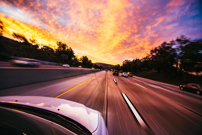 How to Get a Driving License in California View of a Highway from a Car During Sunset