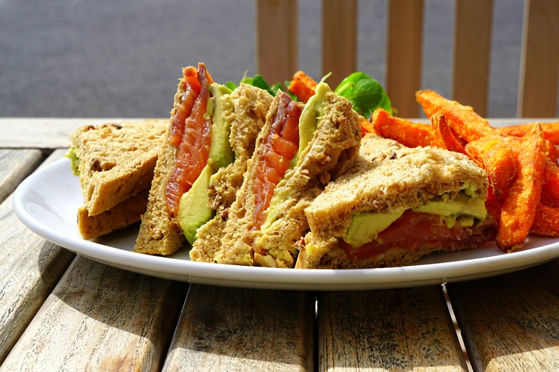 7 Awesome Sandwich Shops in Irvine a Sandwich Cut into Triangles on a Plate with Sweet Potato Fries