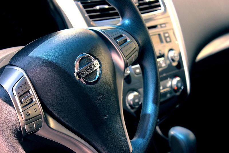 DMV Written Test Question Examples Close Up of a Steering Wheel in a Car