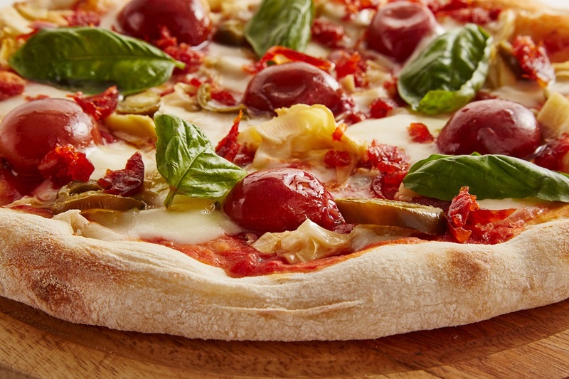 Irvine Pizza Restaurants with Delivery Close Up of a Pizza with Tomatoes and Basil