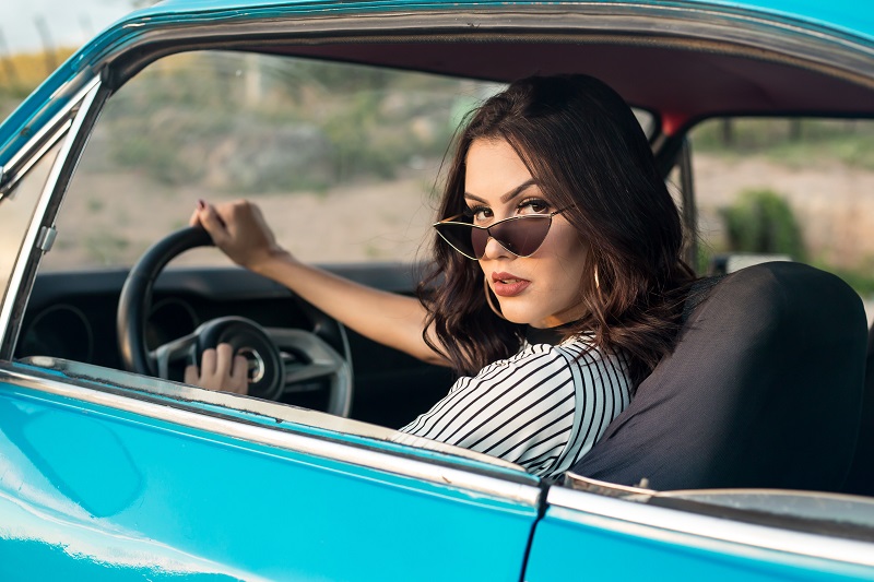 Can an 18 Year Old Drive with Passengers in California Female Teen Sitting in the Driver Seat of a Classic Car