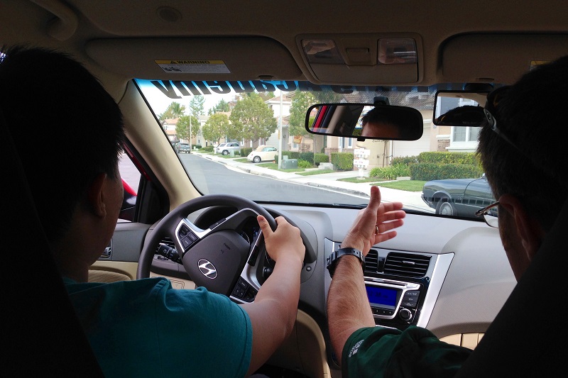 Irvine Adult Driving School Trainer and Student Inside a Car Training
