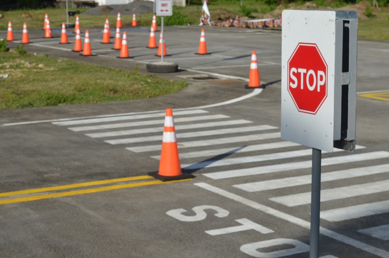 How Much do Driving Lessons Cost in Santa Ana California Close Up of a Stop Sign with a Driving Course All Around