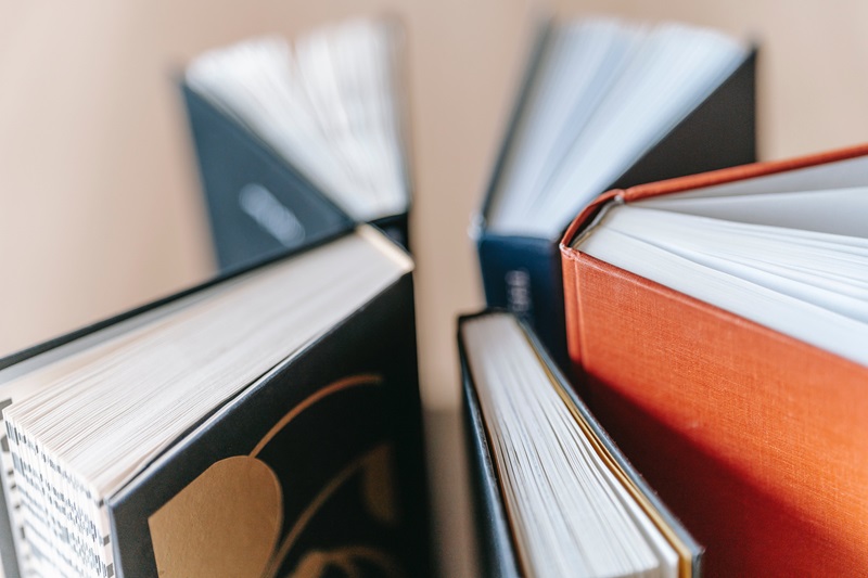 University High School Driver's Ed Close Up of 5 Books Standing in a Circle Each Slightly Open