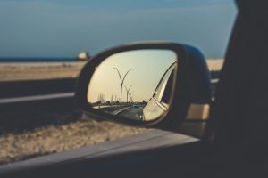 Lakeside High School Driving View of Windmills in a Sideview Mirror of a Car