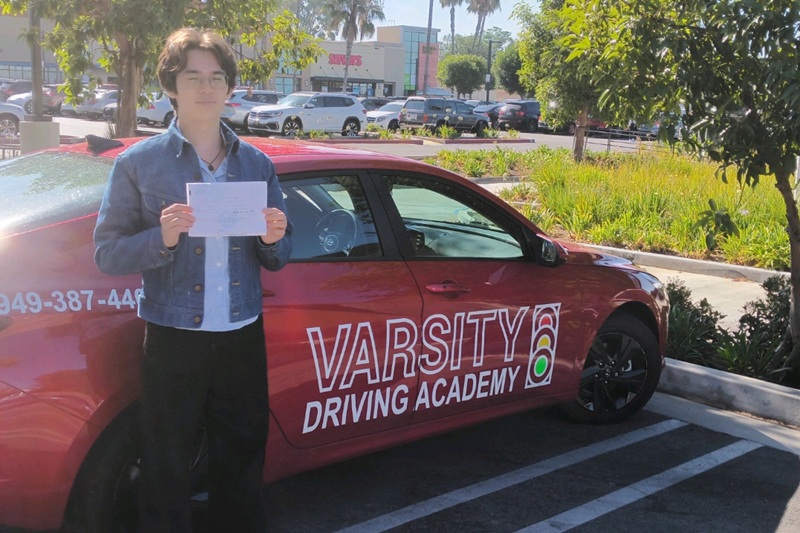 Best Behind the Wheel Training Near Me Newport Beach Student Standing Next to a Training Vehicle