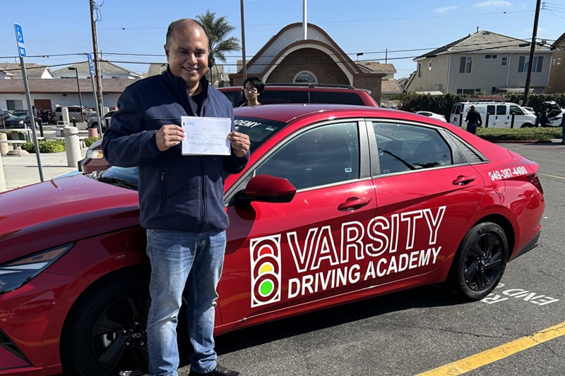 Best Behind the Wheel Training Near Me Newport Beach Adult Student Standing Next to a Training Vehicle in a Parking Lot