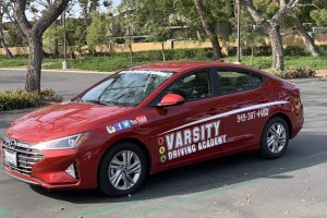 Best Driving School Near Me Newport Beach Training Vehicle Parked in a Parking Lot Outside